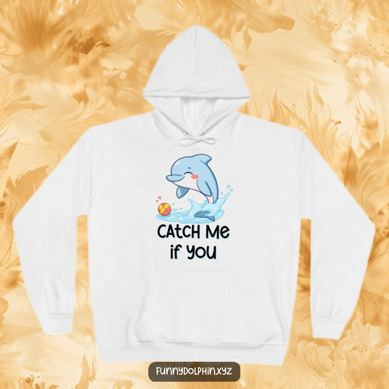 Funny hoodie showcasing a giggling dolphin energetically splashing a tiny, colorful ball with its tail fin. Pure aquatic amusement!